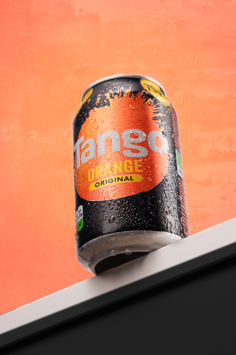 Refreshing Tango Orange soda can with droplets