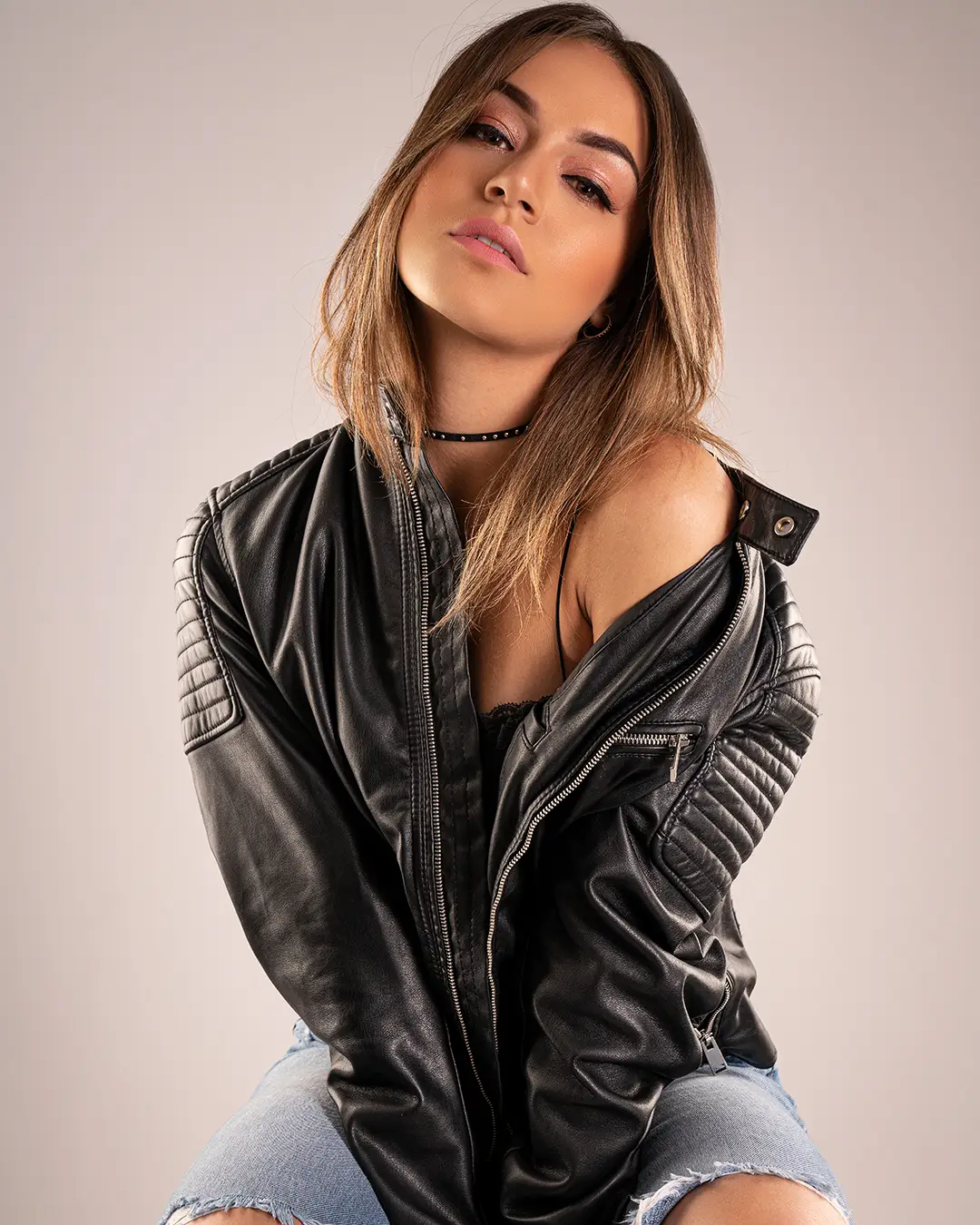 Fashion portrait of a woman wearing a black leather jacket